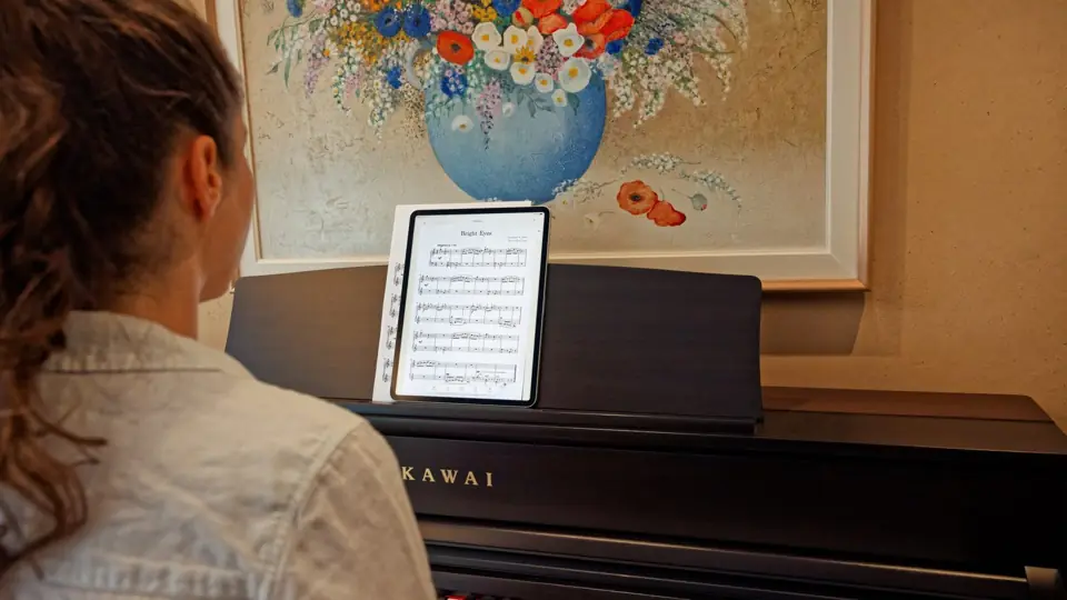 Sheet music on an iPad on the music stand, note names on the notes